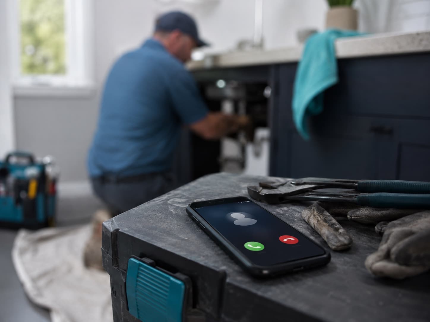 A phone ringing unanswered beside an active job site